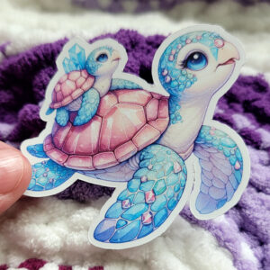 A whimsical illustration of a mother and baby turtle with gem-like shells, adorned with crystals, swimming together in vibrant turquoise and pink hues.