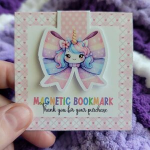 Colorful magnetic bookmark featuring a cute unicorn with a rainbow mane, golden horn, and pastel bow, designed to securely mark pages with charm.
