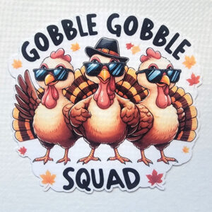 Three cartoon turkeys wearing sunglasses, one with a fedora, surrounded by leaves, with "Gobble Gobble Squad" text.