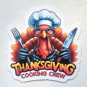 Cartoon turkey chef holding a fork and knife with "Thanksgiving Cooking Crew" text.