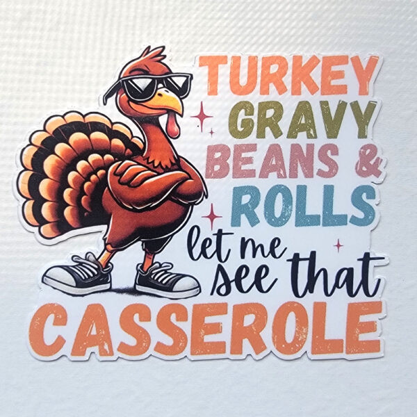 Vinyl sticker of a turkey in sunglasses and sneakers with the phrase "Turkey Gravy Beans & Rolls Let Me See That Casserole."